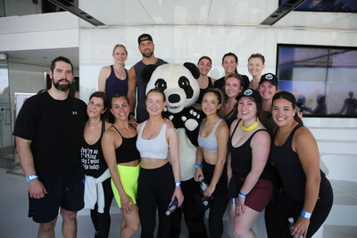 Bachelorette alum and conservationist Blake Moynes (back, left of panda) and his team at the 2023 Climb for Nature x CN Tower © Justin Kielly (CNW Group/World Wildlife Fund Canada)