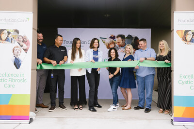 The President of AcariaHealth, Jessica Ciccolella-Kahl, cuts the ribbon at the grand opening celebration in Chesterfield, Missouri, with the assistance of Centene Pharmacy Services CEO and members of the AcariaHealth team.