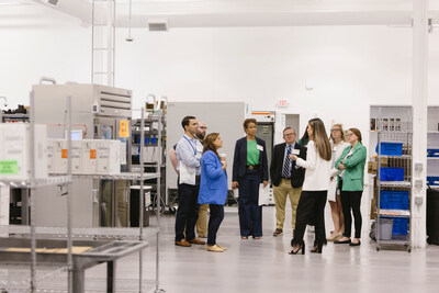 Allison Watson, Foundation Care Manager and Pharmacist in Charge, leads a tour of the new dispensing pharmacy and distribution center.