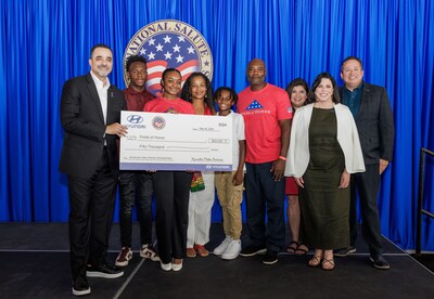 Randy Parker, CEO, Hyundai Motor America, Diane D. Nemecek, Senior Director, Folds of Honor, Angela Zepeda, CMO, Hyundai Motor America, Brandon Ramirez, Director, Corporate Social Responsibility, Hyundai Motor America, pictured with the Gammage family, Folds of Honor Scholarship recipients during the check presentation at the U.S. Coast Guard Air Station in Miami on May 24, 2024.