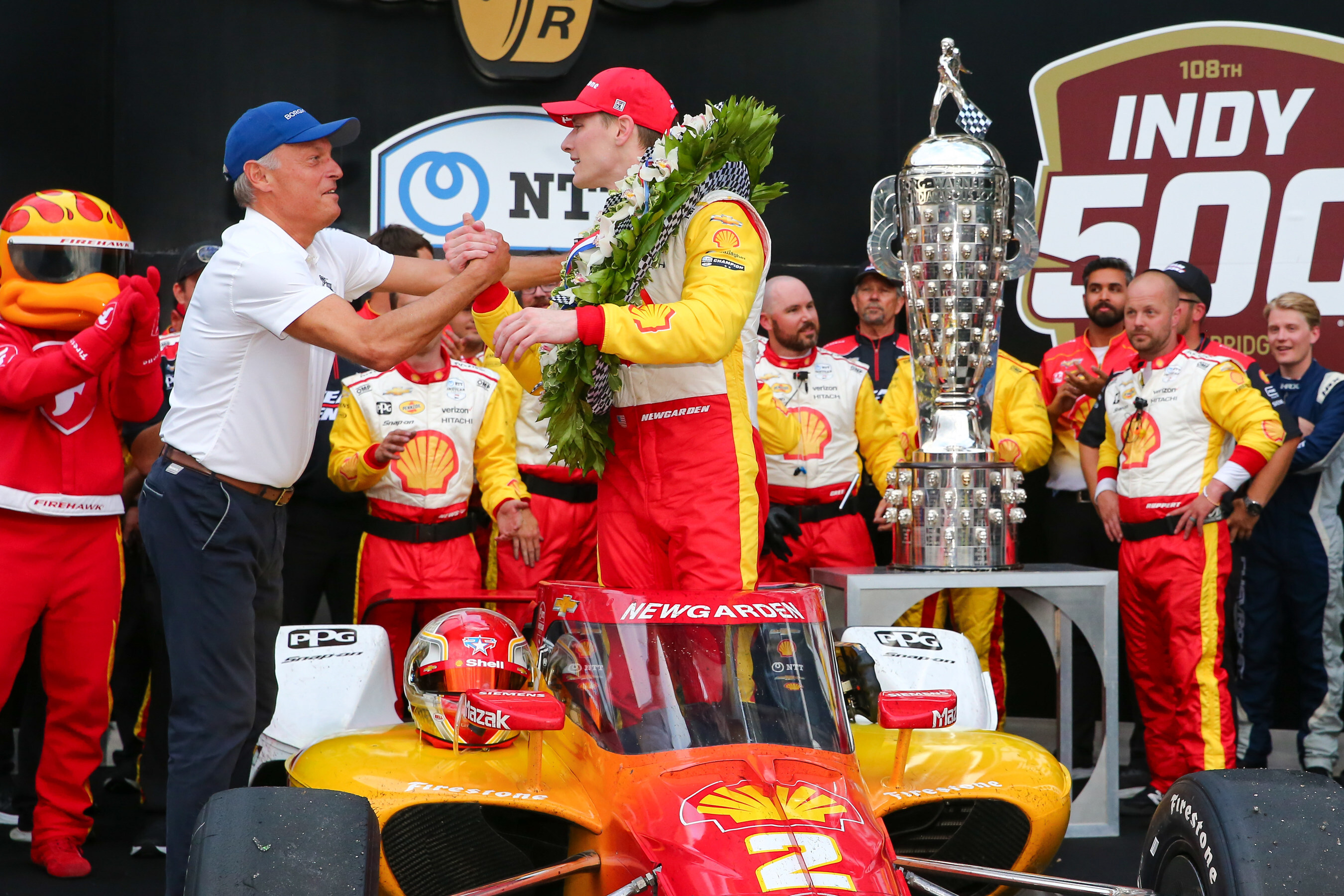 BorgWarner President and CEO Fred Lissalde awarded 2024 Indianapolis 500 winner Josef Newgarden with the Borg-Warner Trophy and Rolling Jackpot bonus for winning back-to-back races.