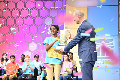 2024 Scripps National Spelling Bee Champion Speller 47 Bruhat Soma of St. Petersburg, FL, representing Rays Baseball Foundation and Rowdies Soccer Fund, receives the Scripps Cup from Adam Symson, President and CEO of The E.W. Scripps Company, in National Harbor, MD, on Thursday, May 30, 2024.  ph: Edward M. Pio Roda / Scripps National Spelling Bee.