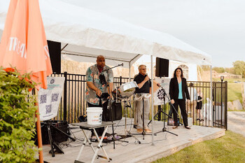 Caption: Leaders of the Harbor Lights team speaking at the VIP opening; Photo Credit: Gianna Palazzo Media