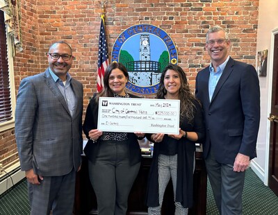 The City of Central Falls received a $125,000 grant from the Washington Trust Charitable Foundation in support of the 'El Centro' Initiative. From L to R: Rolando Lora, Executive Vice President, Chief Retail Lending Officer and Director of Community Lending at Washington Trust; Maria Rivera, Mayor of the City of Central Falls; Zuleyma Gomez, Director of the Office of Constituent Services and Health for the City of Central Falls; and Edward O. "Ned" Handy III, Chairman & CEO at Washington Trust.