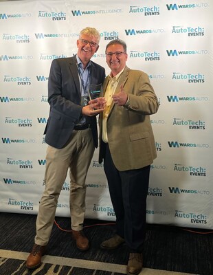 Hans-Hendrik Puvogel, COO, Parkopedia and John Robb, President, HATCI accept the ‘Collaborative Partnership of the Year’ award on June 4, 2024 at AutoTech Detroit.