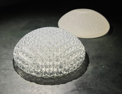 CollPlant's 200cc 3D bioprinted regenerative breast implant  (in front) next to a commercial silicone breast implant