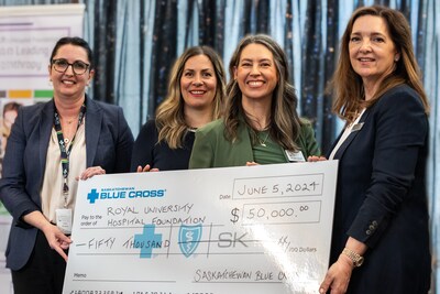 Cheryl de Villiers, Director of Marketing and External Affairs at Saskatchewan Blue Cross (pictured right), presenting cheque to RUH Foundation representatives. (CNW Group/Saskatchewan Blue Cross)