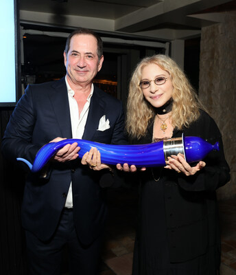 10th Anniversary Genesis Prize Laureate Barbra Streisand receives a glass sculpture of a shofar from Genesis Prize Foundation co-founder Stan Polovets. (Photo by Kevin Mazur/Getty Images for Genesis Prize Foundation)