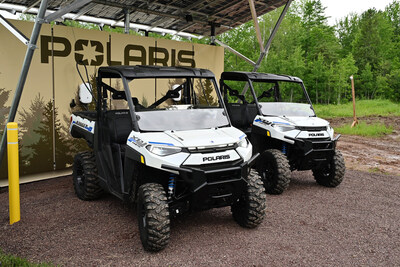 All-electric Polaris RANGER XP Kinetic off-road vehicles charging on the recently launched off-road charging network in Ontonagon, Michigan. (Photo by Daniel Boczarski/Getty Images for Polaris)