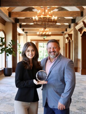 Marc Vorkapich, Principal and CEO of Watercrest Senior Living Group presents Regan Troy, Owner of Troy Social, with the Watercrest Excellence Award for outstanding performance in social media marketing. The Awards presentation was held at the Ritz Carlton Lake Oconee in Greensboro, Georgia.