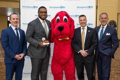 Pennsylvania Lieutenant Governor Austin Davis (left center) receives a Good Neighbor Award from Pennsylvania PBS, with (from left to right) Jim Britt of WQED, Clifford the Big Red Dog, Ron Hetrick of WITF and Bill Marrazzo of WHYY in the East Wing Rotunda of the Pennsylvania State Capitol in Harrisburg on June 12, 2024. (Photo credit: Charity Kennedy Bixler)
