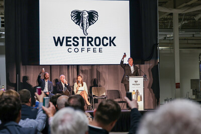 Scott Ford, co-founder and CEO of Westrock Coffee, raises an RTD can produced by Westrock Coffee to officially toast the grand opening of the company's ready-to-drink facility in Conway, Arkansas on June 13, 2024. From left, he is pictured with Will Ford, group president of operations; Joe T. Ford, co-founder and chairman; and Arkansas Gov. Sarah Huckabee Sanders.