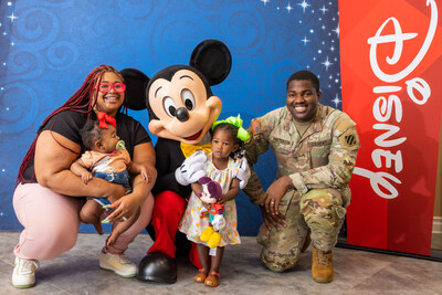 Army family staying at the Bethesda Fisher House takes a photo with Mickey Mouse in Bethesda, Md., Thursday, June 13, 2024. (Photo credit: Disney)