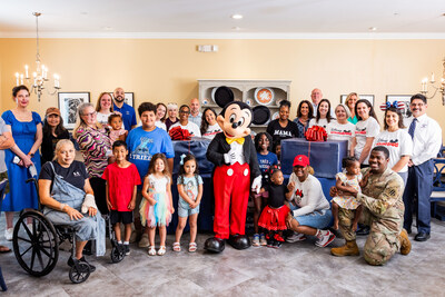 Disney VoluntEARS and Bethesda Fisher House guests take a photo with Mickey Mouse in Bethesda, Md., Thursday, June 13, 2024. (Photo credit: Disney)