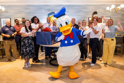 Donald Duck stands alongside Orlando Fisher House guests and Disney VoluntEARS in Orlando, Fla., Monday, June 3, 2024. (Photo credit: Disney)