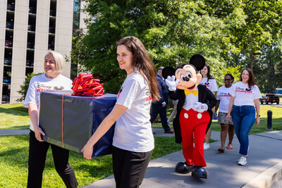 Disney VoluntEARS drop off care packages to the Bethesda Fisher House with special guest Mickey Mouse in Bethesda, Md., Thursday, June 13, 2024. (Photo credit: Disney)