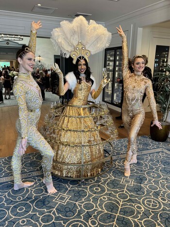 Members Were Greeted By  Cirque Du Soleil Inspired Performers and Champagne