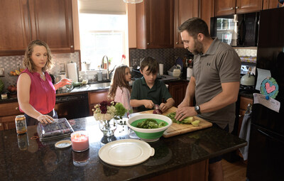 St. Luke’s University Health Network Physician Assistant, Nick Lumi, turns making dinner into a family affair as his wife, Sarah, along with their two children Anna, 8, and Nathan, 10, at their Nazareth home. Nick recently participated in St. Luke’s DNA Answers program and is encouraging others to do the same in the hopes that potential future illness could be either prevented and closely monitored by the discovery of genetic markers.