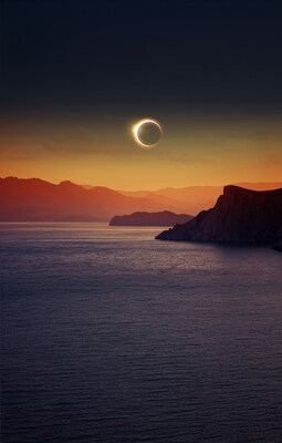 Total solar eclipse, mountains, and sea.