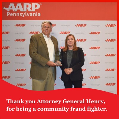 Bill Johnston-Walsh, AARP Pennsylvania State Director (Left), presenting Pennsylvania Attorney General Michelle Henry (Right) with an AARP Community Fraud Fighter Award