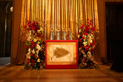 The Kansas City Chiefs' four Lombardi Trophies were exhibited in a custom display case complemented with red and white floral displays and gold draping. Photo credit: Chiefs