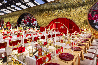 Tablescapes included Chiefs' red roses, white roses, candles, and gold ring displays. Photo credit: Matt Teuten