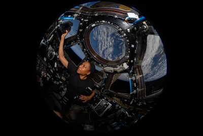 (April 8, 2024) NASA astronaut Jeanette Epps uses a camera in the International Space Station’s cupola to take photographs of the Moon’s shadow umbra as a total solar eclipse moves across Earth’s surface during Expedition 71. Credits: NASA/Matthew Dominick