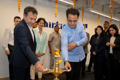 Traditional lamp lighting ceremony with Metin Taskin, CEO of Airties (left) and dignitary guest Dr. Ashwath Narayan C. N (right).