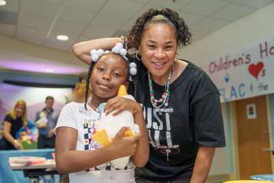 Carmen, with the help of Coach Staley, crafted a special necklace for her My Special Aflac Duck at the delivery event. The robotic companion is available free of charge for children 3 years or older who have been diagnosed with cancer or sickle cell disease.