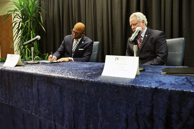 (Aron Smith/University Communications) JSU President Marcus L. Thompson, Ph.D. and University of Mississippi Chancellor Glen Boyce, Ed.D., seal the deal by signing an MOU that will help JSU students receive their undergraduate degree and law degree in six years.