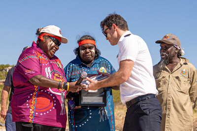 Wunambal Gaambera Aboriginal Corporation Chair Catherine Goonack, Wunambal Gaambera Traditional Owner Maria Fredericks, and Wunambal Gaambera Traditional Owner Desmond Williams present Seabourn Pursuit Captain Ertan Vasvi with books about their history about culture.