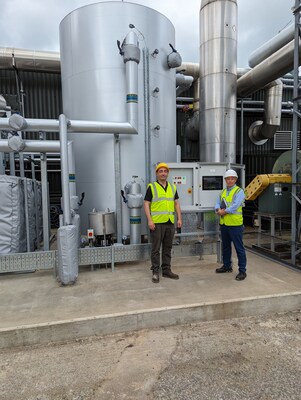 Photo (Left to Right): Galvin Kilbourn, Head of Engineering and Gareth Drew, Projects Manager at Hain Celestial, stand in front of a new hot water system that is helping to process fruit waste into biogas to generate electricity.