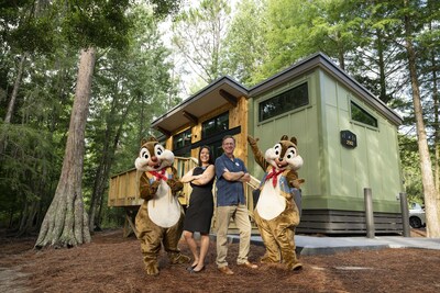 Senior vice president and general manager of Disney Vacation Club, Bill Diercksen,and Disney's Fort Wilderness Resort & Campground General Manager, Lauren Gossett, commemorate the opening The Cabins of Disney's Fort Wilderness Resort. 
 Disney