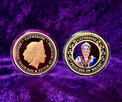 The 24-Karat Gold plated coin highlights an image of Catherine - Princess of Wales in her Coronation Day dress. The reverse (on left) features a fully sculpted profile of Princess Catherine wearing the "Lovers Knot" tiara. This non-monetary commemorative coin measures 39mm (1 1/2 inches) in diameter. Minted in the United Kingdom.
