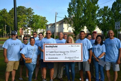 Smithfield Foods North Carolina employees present a check for $10,000 to the Lumbee Regional Development Association, Inc.