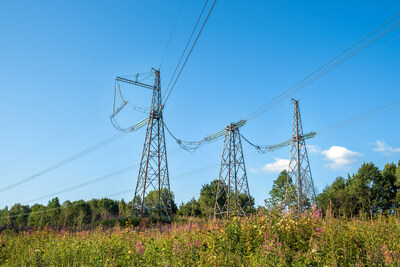 View of fragment of power line as component of large electrical networks and system of power equipment. Electricity transmission, electric current. Energy supply of regions. Selective focus. (CNW Group/Canada Infrastructure Bank)