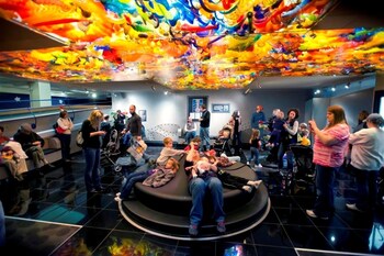 Families become a human kaleidoscope at The Children's Museum of Indianapolis.