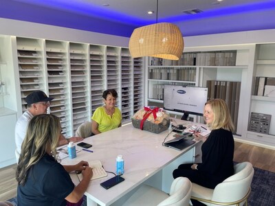 One of Mattamy’s Design Consultants pictured with the first appointment at the new design studio located in Venice, Florida. (CNW Group/Mattamy Homes Limited)