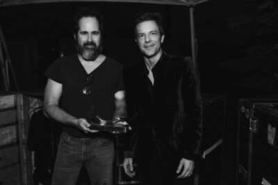 Photo (L-R): The Killers’ Ronnie Vannucci Jr. and Brandon Flowers receive SoundExchange Hall of Fame Award before their headlining set at last month’s Boston Calling festival. (Photo credit: Chris Phelps)