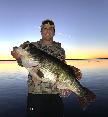 Florida's Luke Matthews wrestles giant bass out of gator-infested waters.