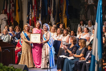 Lois MacMillan, center, received Outstanding Teacher of American History. In 30 years, she's taught American History, AP Government and Politics, and World History Kindergarten through high school.