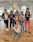 A group of moms attending the baby-wearing dance class at The Canopy NYC