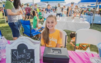A young entrepreneur proudly showcases her slime business during the Children's Entrepreneur Market. Join us on November 16, 2024, at Fairview Town Center in Fairview, Texas, to support and inspire the next generation of business leaders in our vibrant community.