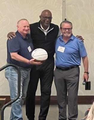 From left to right: Pat Grant, President of BBI, "Clyde The Glide" Drexler, and Tony Frankenberger, CEO of McLane Company.