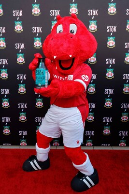 Wrex the Dragon with limited-edition Wrexham-branded STōK Cold Brew bottles