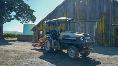 Monarch Tractor's MK-V electric tractor with implement attached and ready for work.