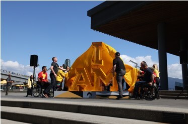 Members of the Invictus Games 2025 family members joined the I AM sign unveiling moment, including Canadian athlete and activist Rick Hansen and Invictus Games Team Canada alumni, Patrick Lévis. (CNW Group/Invictus Games Vancouver Whistler 2025)