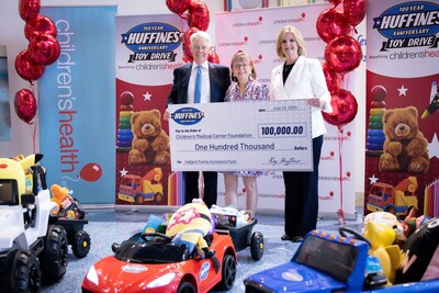 Ray and Ann Huffines present $100,000 donation to Children’s Medical Center Foundation Vice President of Development Paulette Mulry.