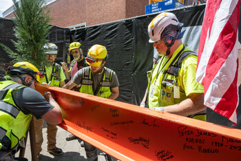 Mortenson team members signing the final steel beam in construction of the Portland Art Museum’s Mark Rothko Pavilion on July 22, 2024.
