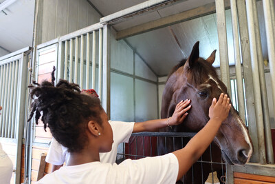 AspireNJ Youth Healing Hooves Participants interacting with Horse.